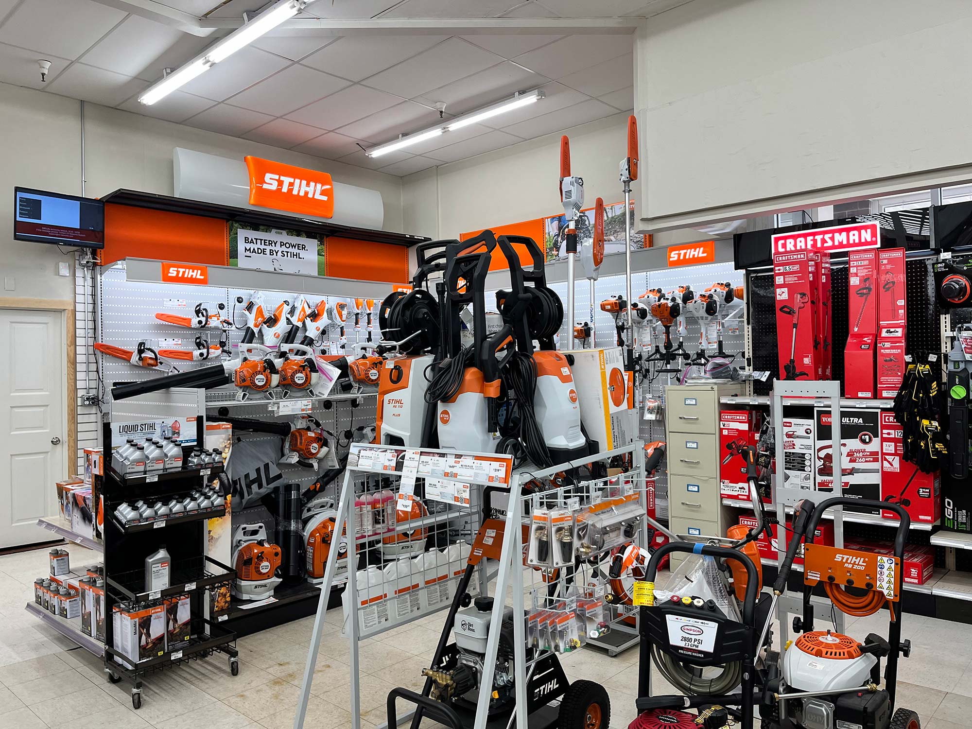 A store section featuring STIHL landscaping tools and equipment, including chainsaws, trimmers, blowers, and pressure washers. CRAFTSMAN products are also displayed on the right side.