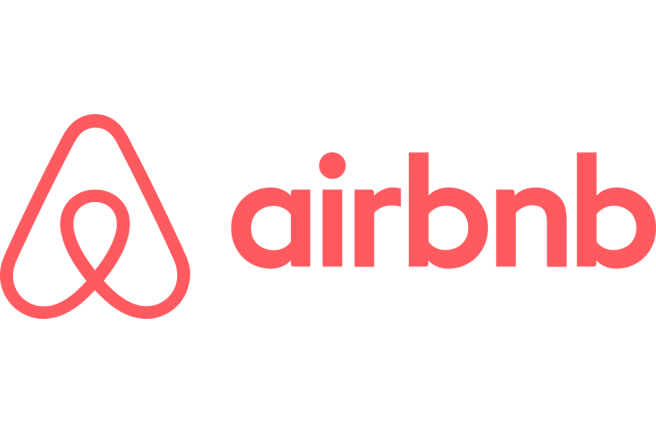 Airbnb logo featuring a stylized "A" symbol in coral color to the left of the word "airbnb" written in lowercase letters in the same coral color.