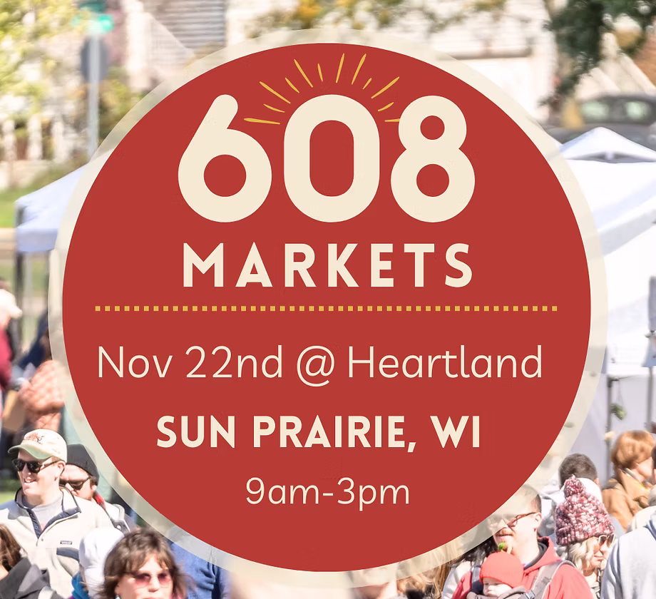 Large red circular sign with "608 Markets, Nov 22nd @ Heartland, Sun Prairie, WI, 9am-3pm" over a blurred outdoor market scene with people.